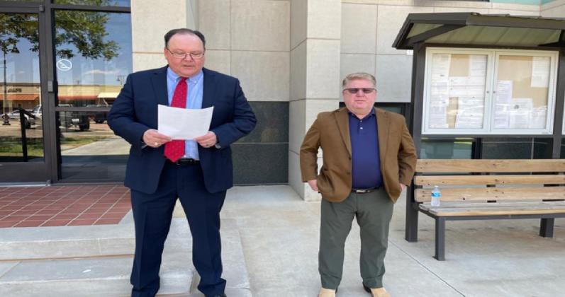 Attorneys Marlin Carter and Paul Mansur continued the TCDLA's tradition of publicly reading the Declaration of Independence prior to or on the Fourth of July. The two joined forces on the steps at the Gaines County Court-House on Friday, July 1. (Sentinel photo)